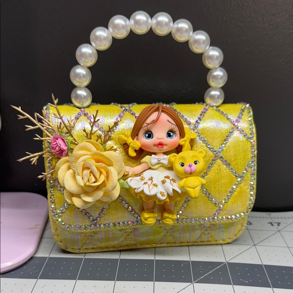 None Other - Yellow Pearl-Handle Kids Handbag with Doll and Flower Accent